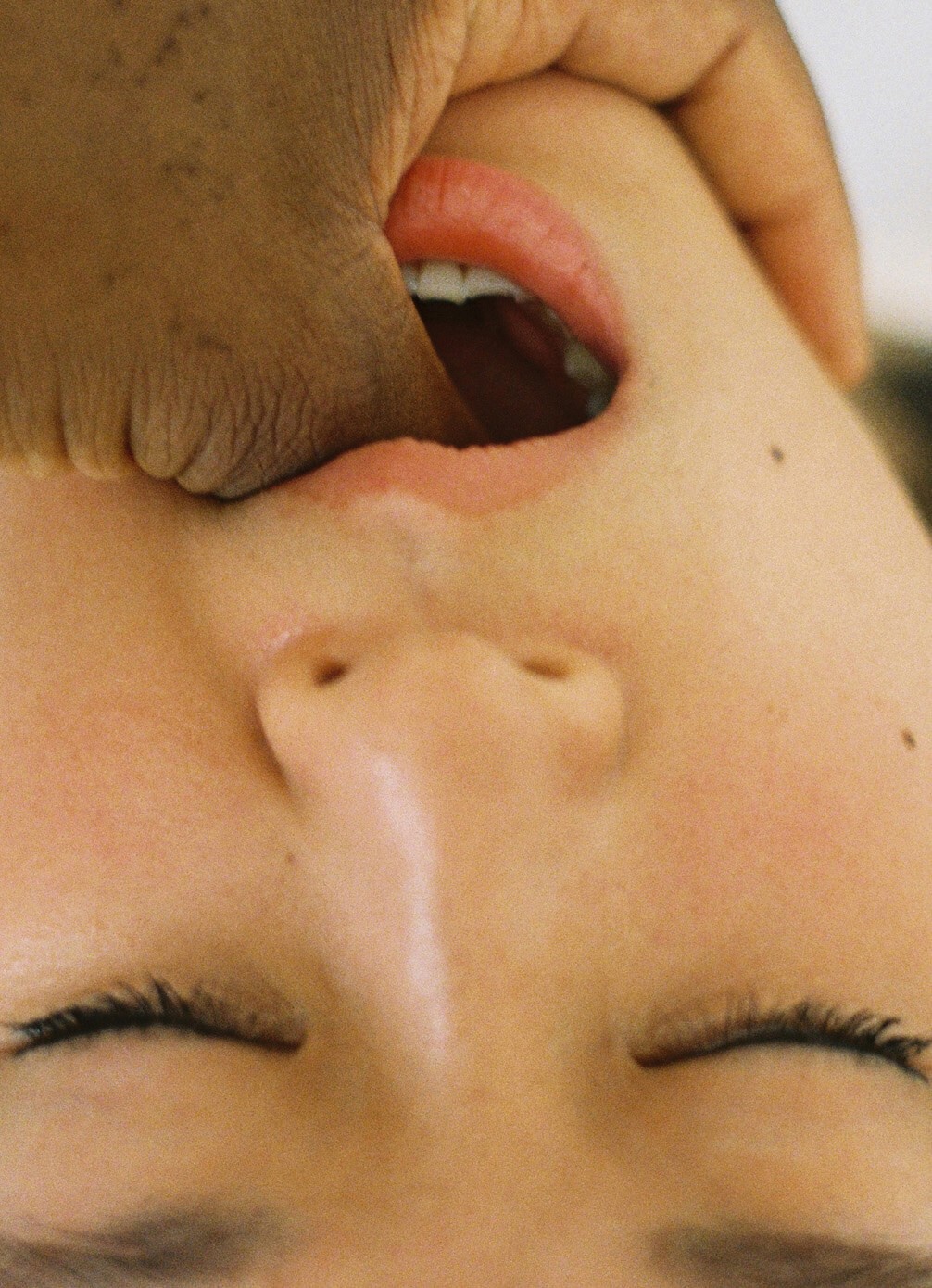 Hand in mouth shot by Ray Litsala