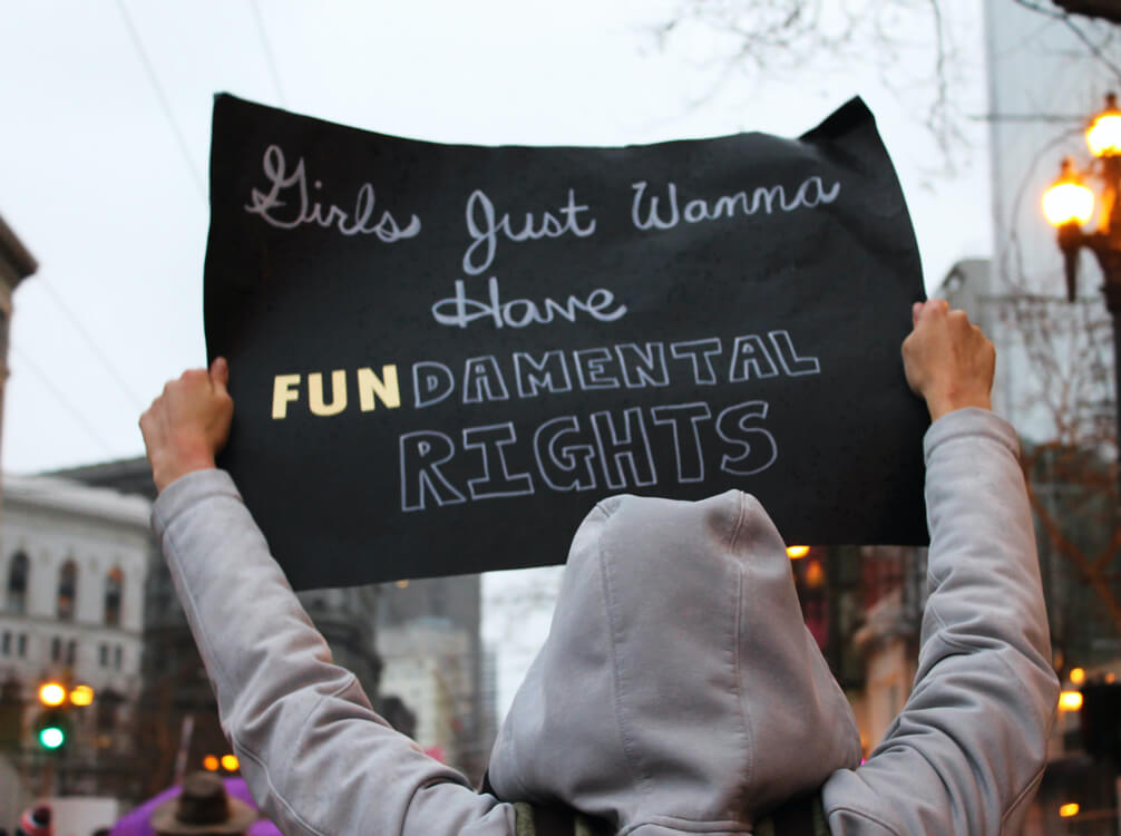 Poster saying Girls just wanna have fundamental rights shot by Lucia for SISEA